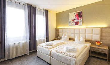 billede på Superior Triple Room-2 Twin Beds and 1 Large Twin Sofa Bed Free WiFi